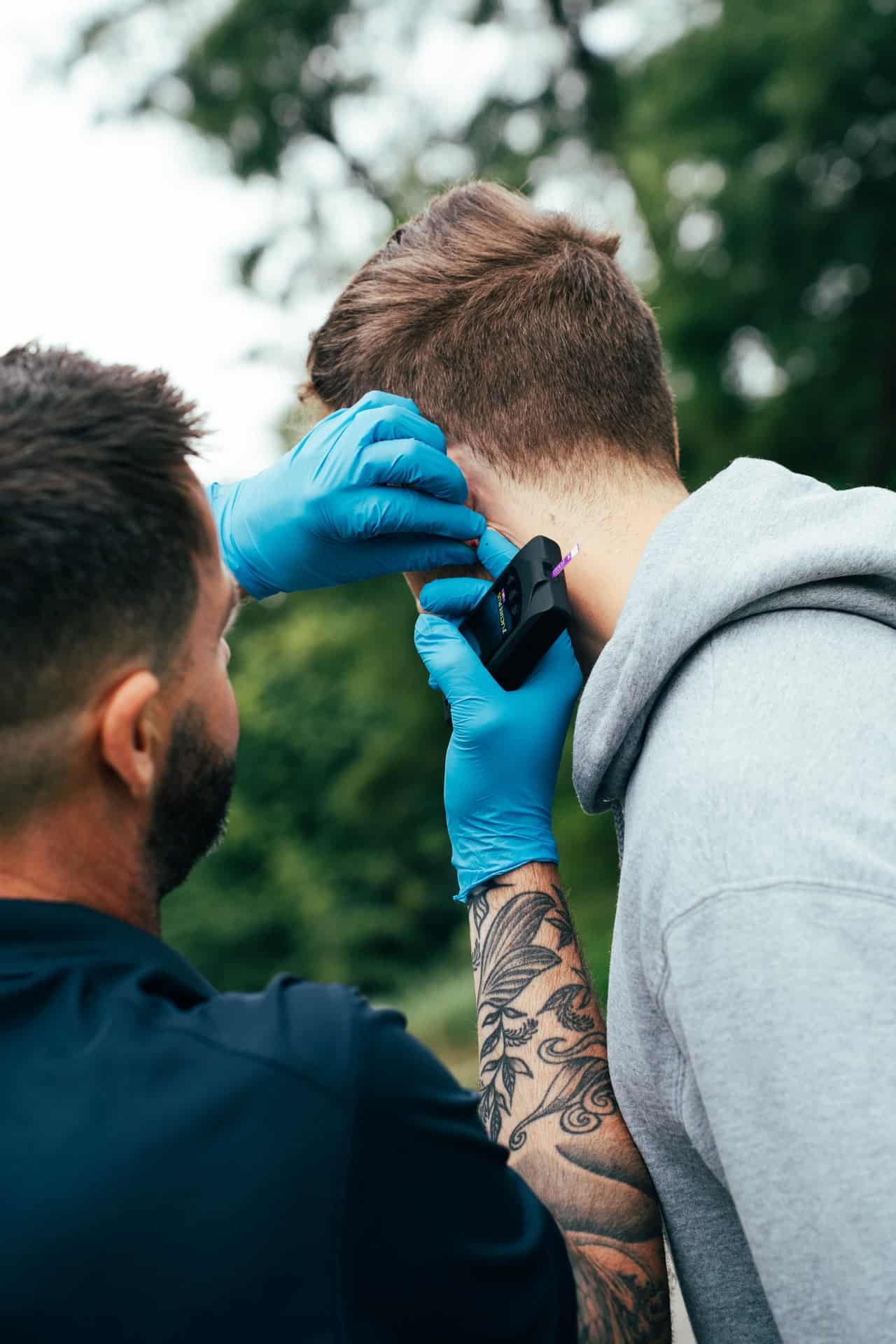 matt takes baseline lactate sample of runner conducting an INSCYD test